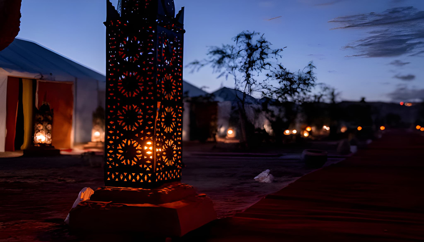 Luxury desert camp in Morocco surrounded by Sahara dunes